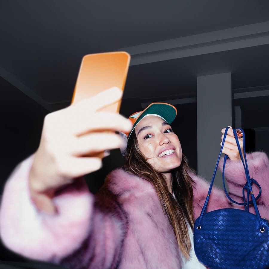 woman taking a selfie with mobile