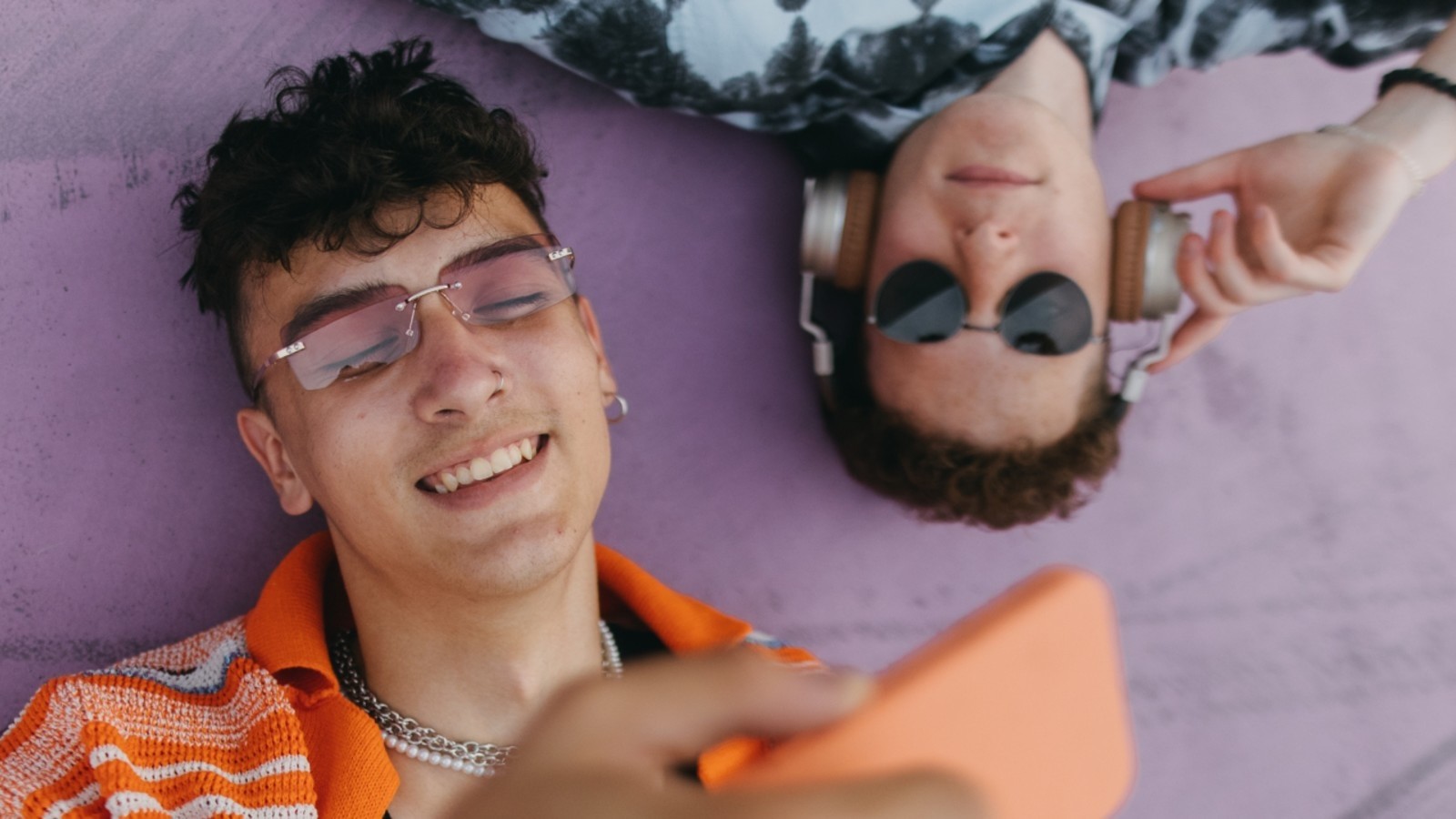 two young men looking at mobile