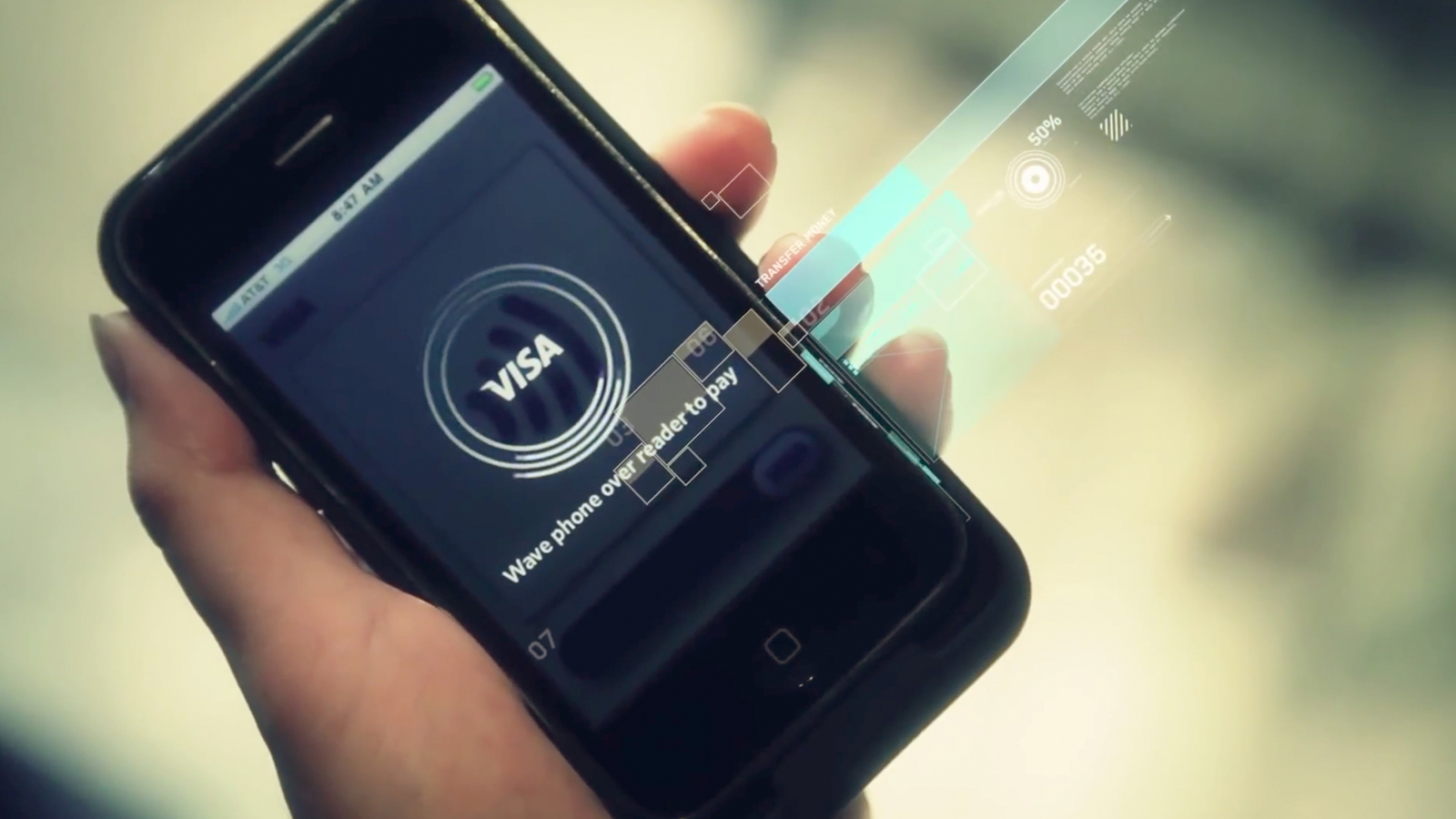 Closeup of a hand holding a smartphone displaying 'Visa' and the phrase 'Wave phone over reader.'
