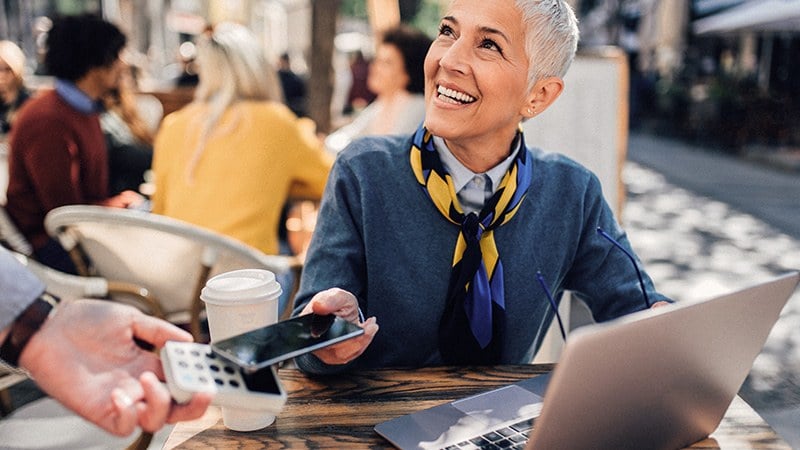 Woman paying using contactless