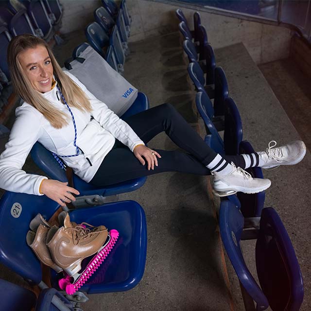 ice skater sitting in stands