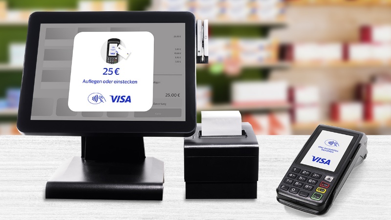 Payment terminals on a desk with visa logo