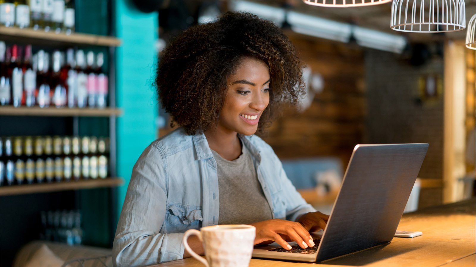 Person on laptop in cafe